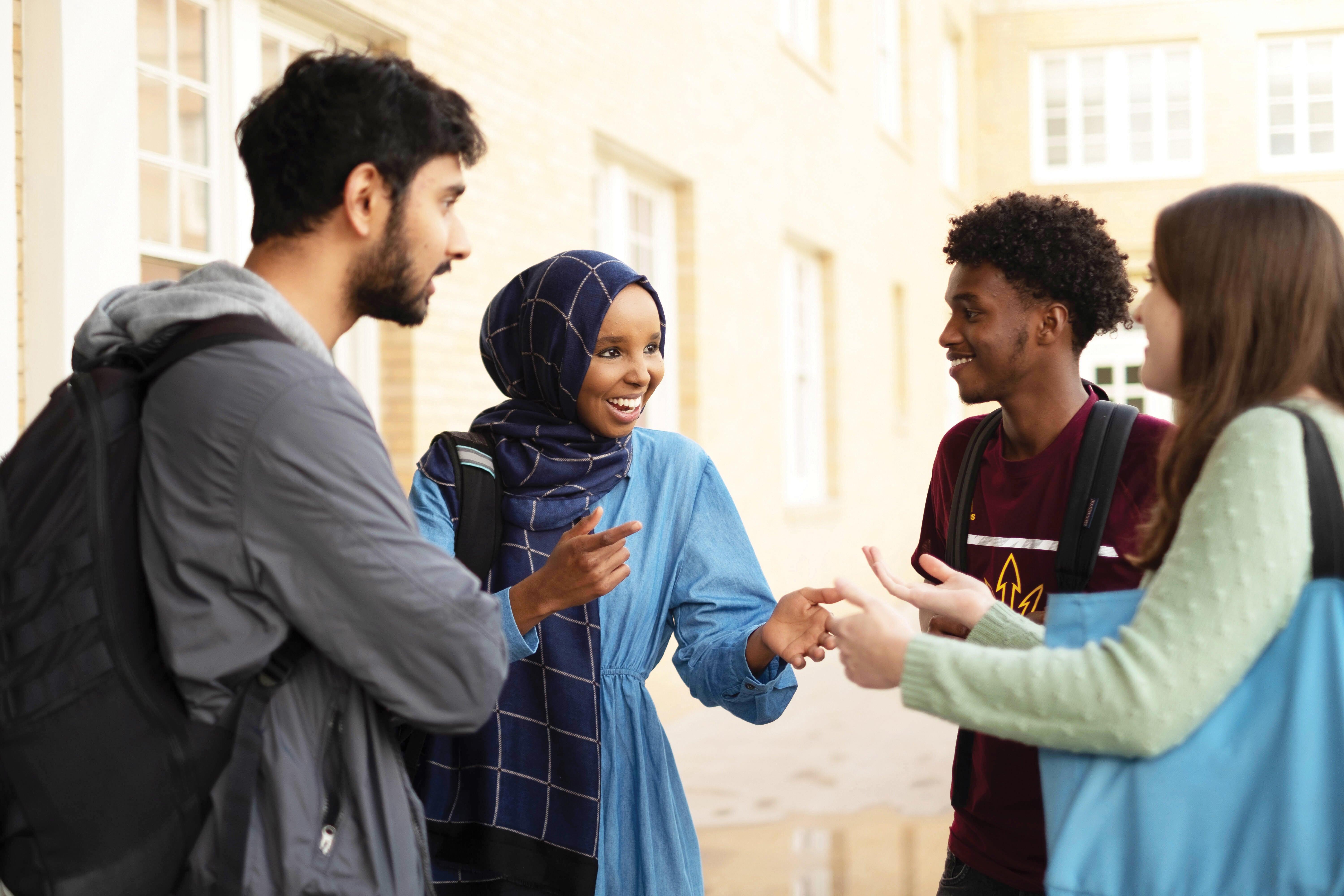 Four students having a conversation